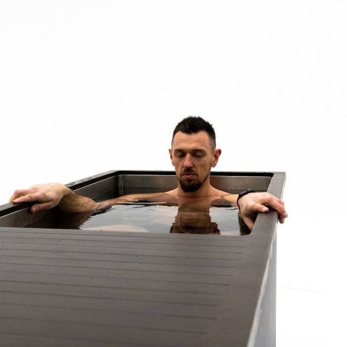 man inside a portable ice bath