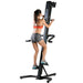 A woman is doing a full body workout using the VersaClimber Sport