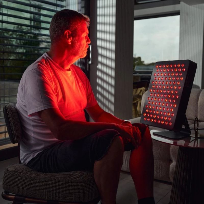 Red light therapy device in use for targeted recovery session
