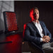 Red light therapy panel for pain set up on home desk